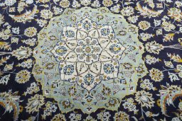 Central medallion detail of 2000s Kashan rug from Iran / Persia
