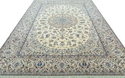 Surface texture of 2000s Nain rug with natural Wool and intricate pattern