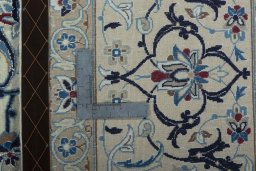 Backside of handmade 2000s Nain rug showing knot structure and weave density