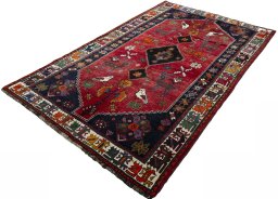 Corner detail of 2000s Shiraz rug showing border pattern and Wool pile