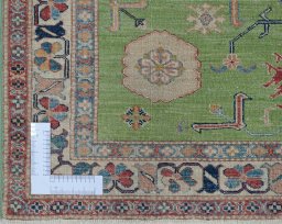 Corner detail of New Kazak rug showing border pattern and Wool pile