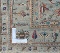 Corner detail of New Kazak rug showing border pattern and Wool pile