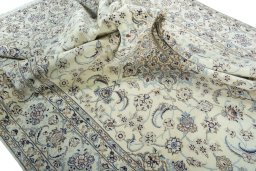 Surface texture of 2000s Nain rug with natural Wool and intricate pattern