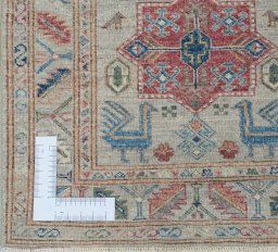 Corner detail of New Kazak rug showing border pattern and Wool pile