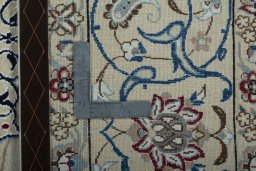 Backside of handmade 2000s Nain rug showing knot structure and weave density