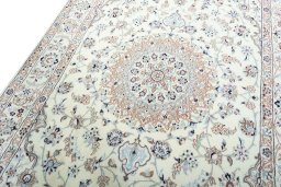 Backside of handmade New Nain rug showing knot structure and weave density