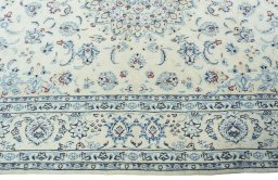 Corner detail of New Nain rug showing border pattern and Wool pile