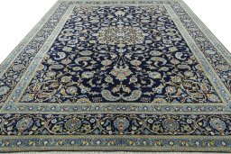Surface texture of 2000s Kashan rug with natural Wool and intricate pattern