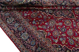 Close-up detail of 2000s Kashan rug from Iran / Persia showing Wool weave