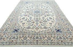 Surface texture of 2000s Nain rug with natural Wool and intricate pattern