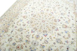 Backside of handmade New Kashan rug showing knot structure and weave density