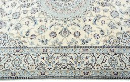 Corner detail of 2000s Nain rug showing border pattern and Wool pile