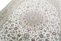 Backside of handmade 2000s Kashan rug showing knot structure and weave density