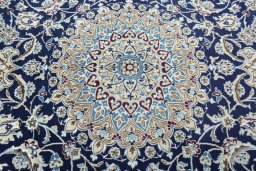 Central medallion detail of New Nain rug from Iran / Persia