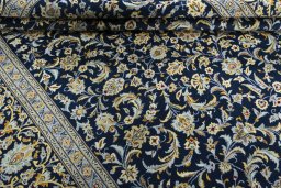 Close-up detail of 2000s Kashan rug from Iran / Persia showing Wool weave