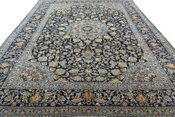 Surface texture of 2000s Kashan rug with natural Wool and intricate pattern