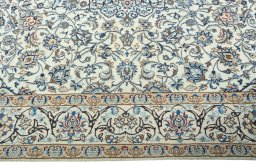 Corner detail of 2000s Nain rug showing border pattern and Wool pile