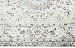 Corner detail of 2000s Nain rug showing border pattern and Wool pile