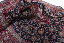 Surface texture of 2000s Kashan rug with natural Cork and intricate pattern