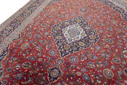 Backside of handmade New Kashan rug showing knot structure and weave density