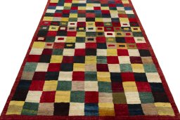 Surface texture of 2000s Persian Gabbeh rug with natural Wool and intricate pattern