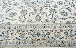 Corner detail of 2000s Nain rug showing border pattern and Wool pile
