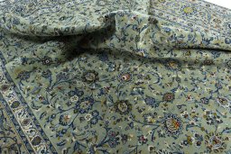 Surface texture of 2000s Kashan rug with natural Wool and intricate pattern