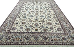 Surface texture of 2000s Mashad rug with natural Wool and intricate pattern