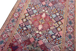 Backside of handmade 2000s Kashan rug showing knot structure and weave density