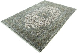 Corner detail of 2000s Kashan rug showing border pattern and Wool pile