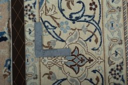 Backside of handmade 2000s Nain rug showing knot structure and weave density