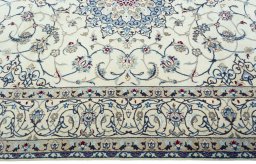 Corner detail of 2000s Nain rug showing border pattern and Wool pile