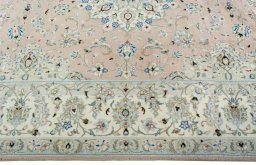 Corner detail of New Kashan rug showing border pattern and Wool pile