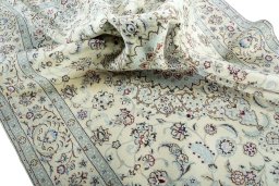 Surface texture of 2000s Nain rug with natural Wool and intricate pattern