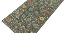 Backside of handmade New Farahan rug showing knot structure and weave density