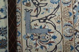Backside of handmade 2000s Nain rug showing knot structure and weave density