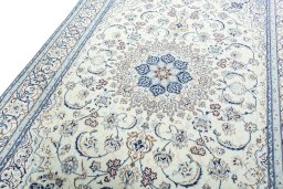 Backside of handmade 2000s Nain rug showing knot structure and weave density
