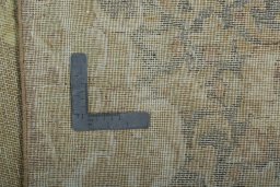 Backside of handmade 1970s Vintage rug showing knot structure and weave density