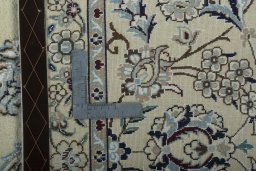 Backside of handmade 2000s Nain rug showing knot structure and weave density