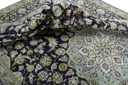 Surface texture of 2000s Kashan rug with natural Wool and intricate pattern