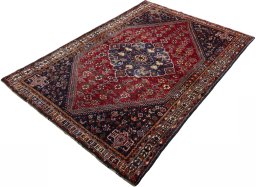 Corner detail of 2000s Shiraz rug showing border pattern and Wool pile