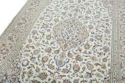 Backside of handmade 2000s Kashan rug showing knot structure and weave density